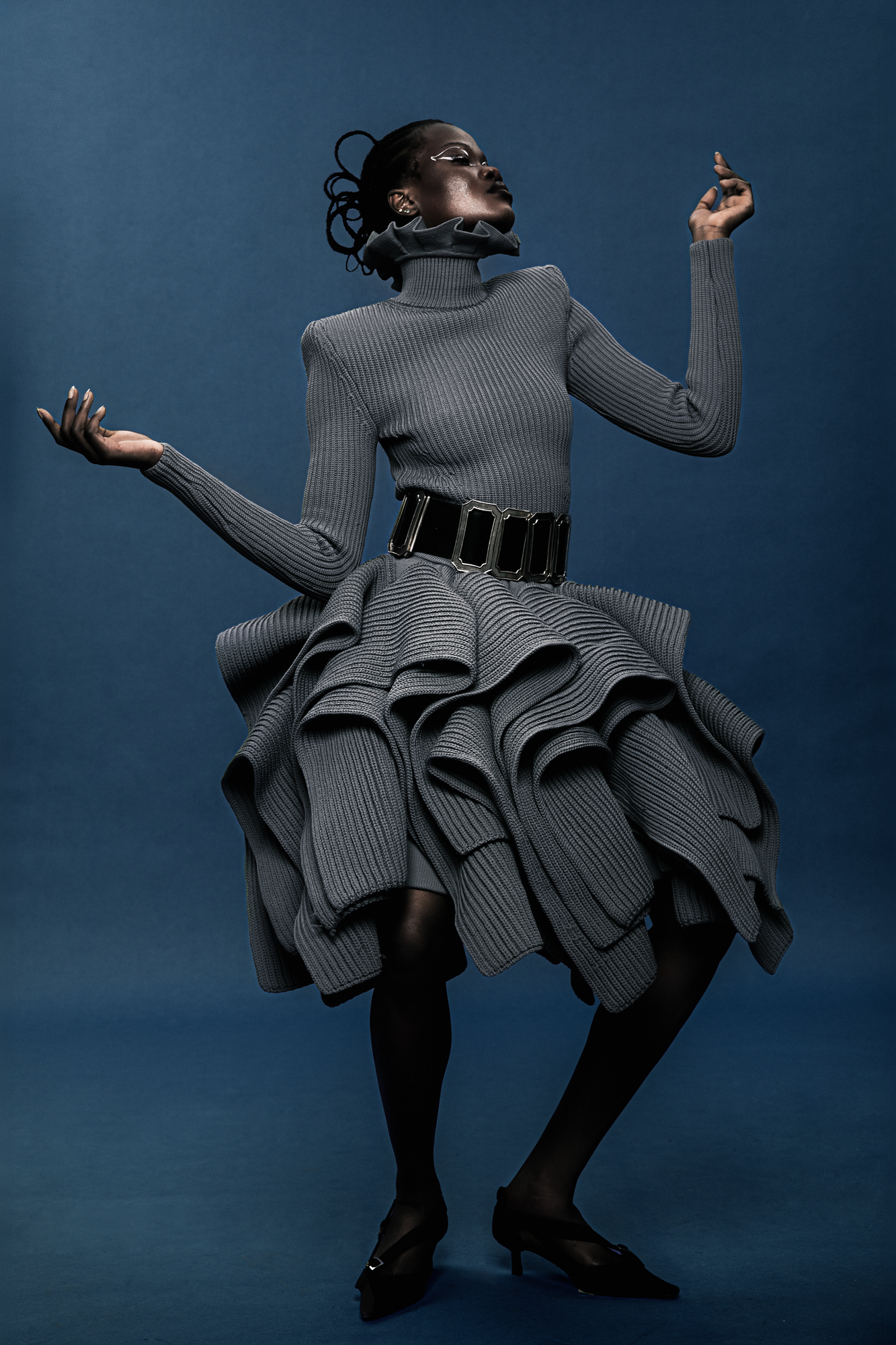 Studio fashion photography editing showcasing designer knitwear texture and clean studio background