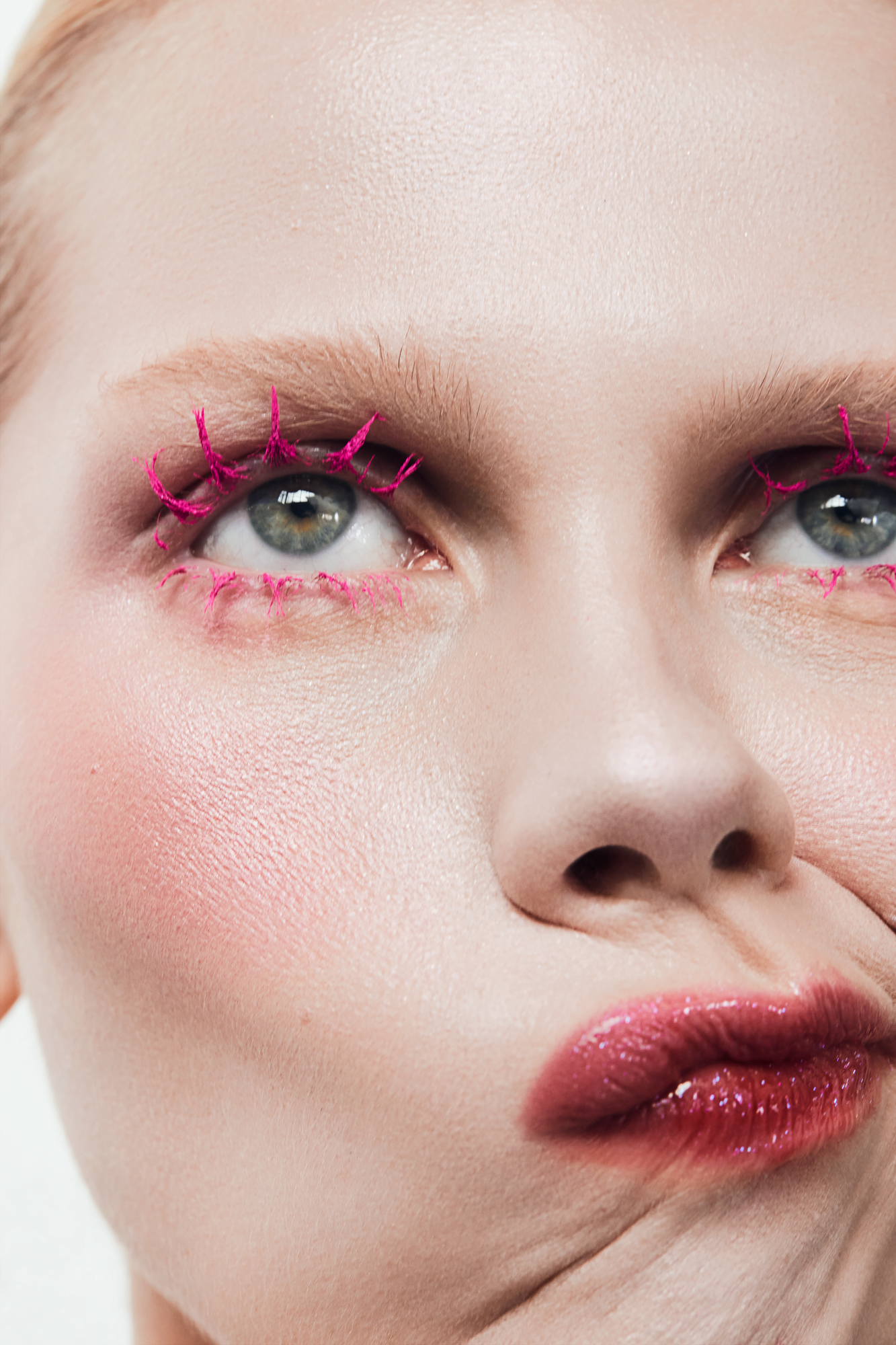 Professional macro beauty retouch focusing on clean brow lamination and sharp makeup details