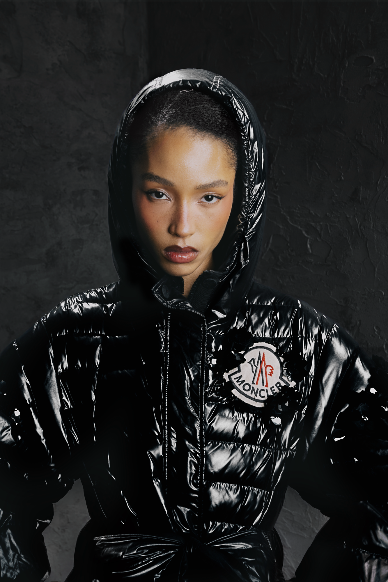 High end fashion retouching for luxury outerwear brand showcasing glossy puffer jacket texture